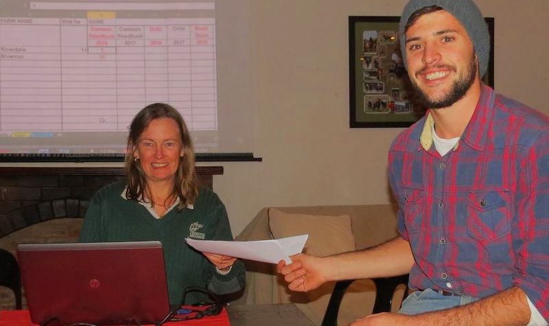 Gerrit Byleveld hands his game data to Caroline Leslie